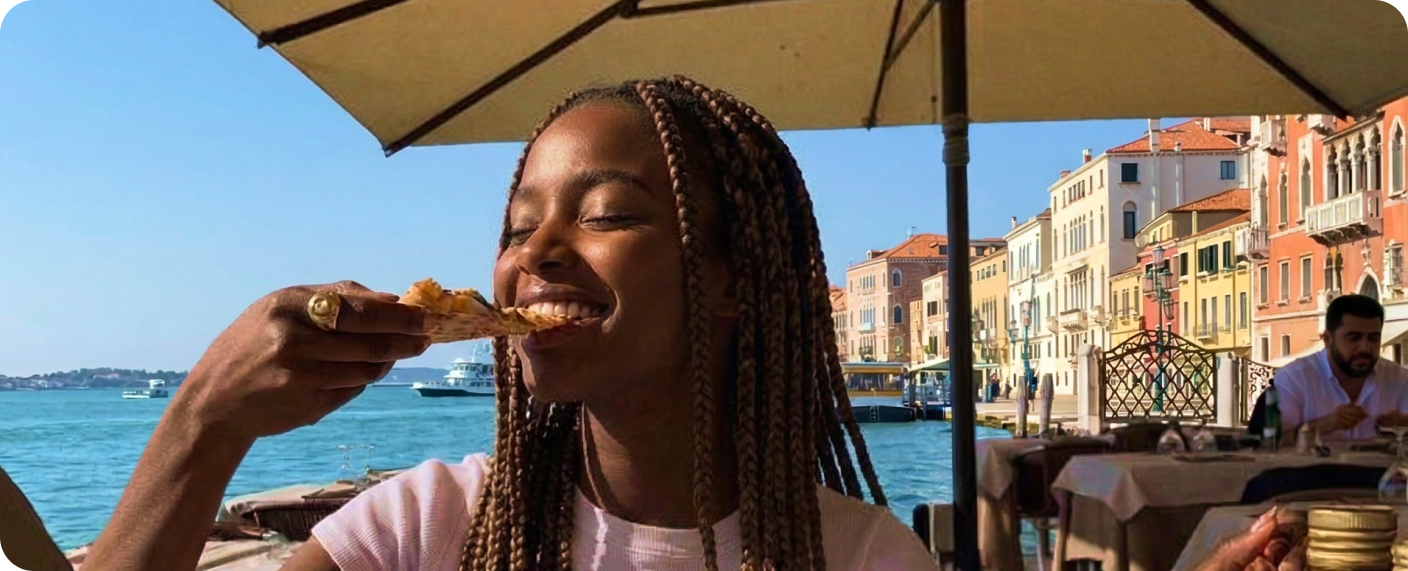 Person enjoying a meal by the water