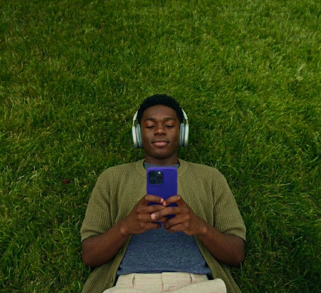 Person relaxing with their phone